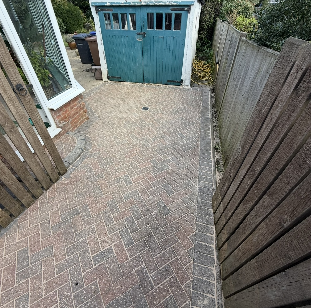 Clean restored garden patio path after expert jet washing services by JS Jets Hertfordshire