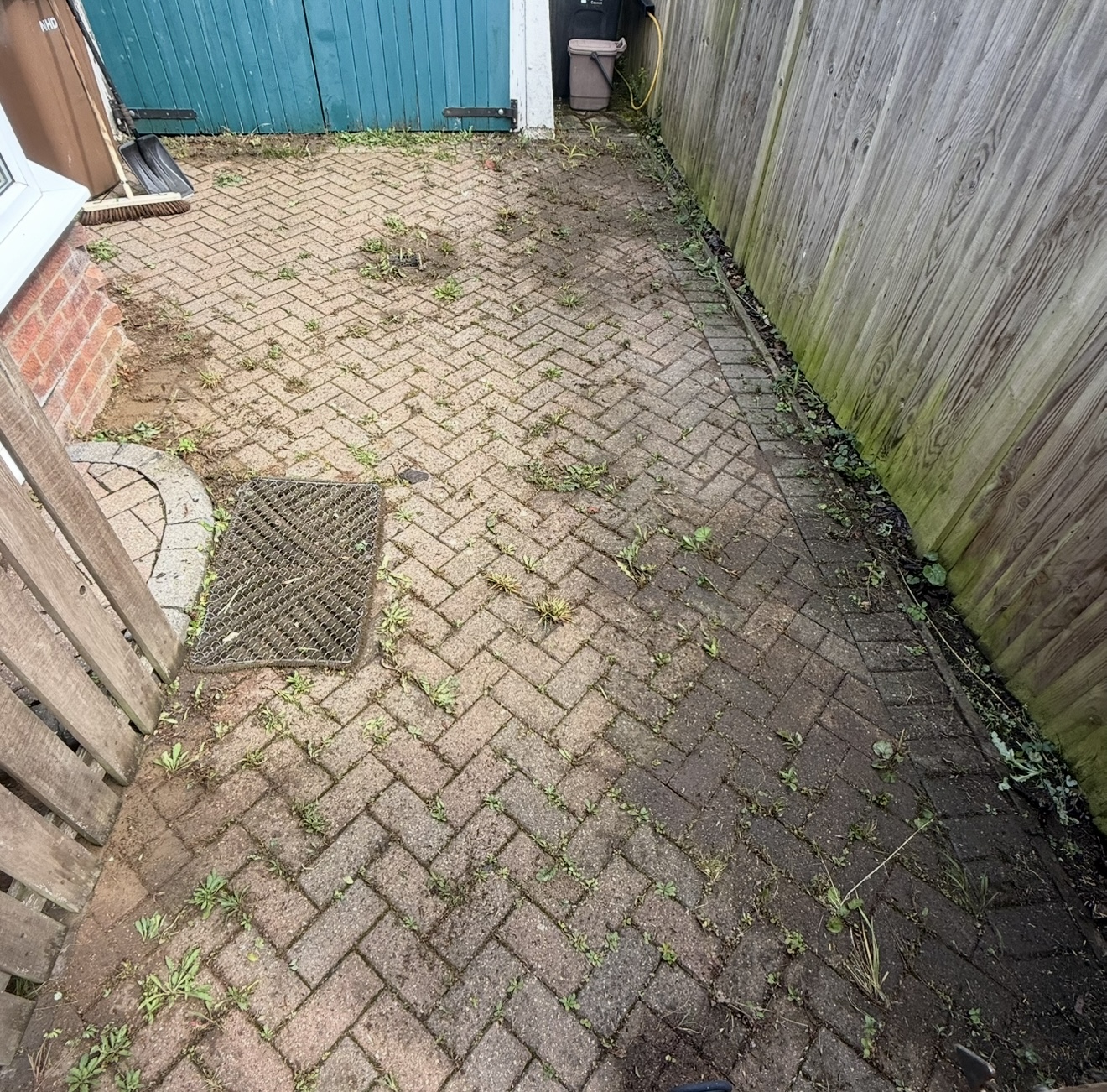 Grimy garden patio path before professional exterior cleaning service in Hitchin Hertfordshire