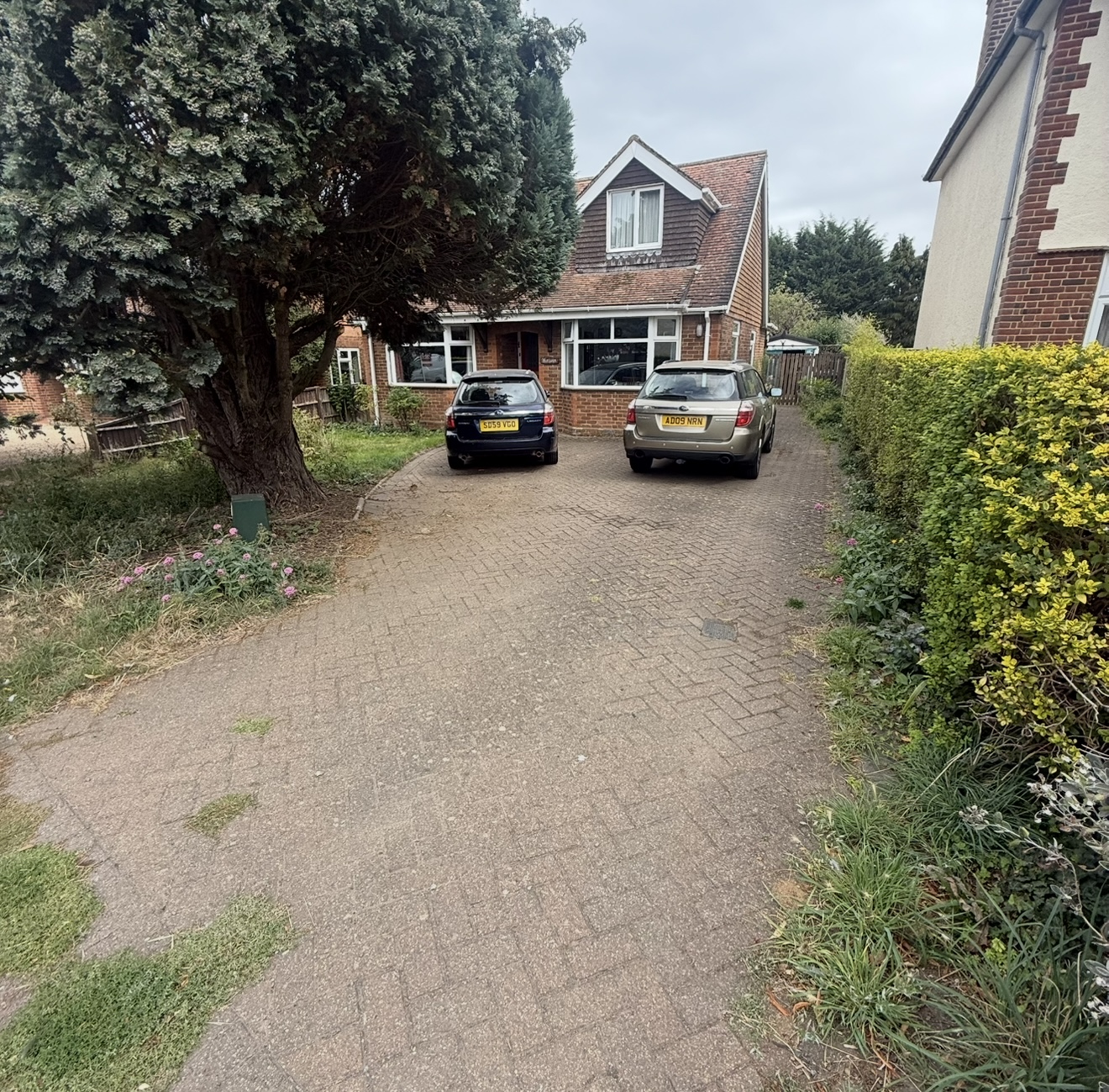 Stained block paving surface before professional cleaning services in Letchworth Hertfordshire